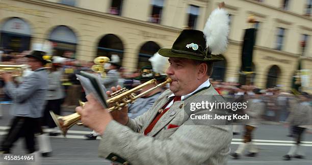 Local bavarian brass group takes part at the traditional costume parade on day two of the 2014 Oktoberfest on September 21, 2014 in Munich, Germany....