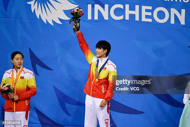 Zhang Yuhan of China wins gold in the final of women's freestyle 400m during day two of the 2014 Asian Games at Munhak Park Tae-hwan Aquatics Center...