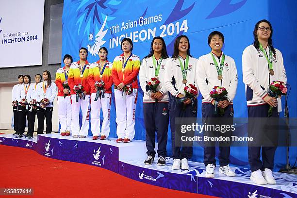 Gold medalists, Shiwen Ye, Duo Shen, Yufei Zhang and Yi Tang of China pose atop the podium after the Women's 4 x 100m Freestyle Relay Final during...