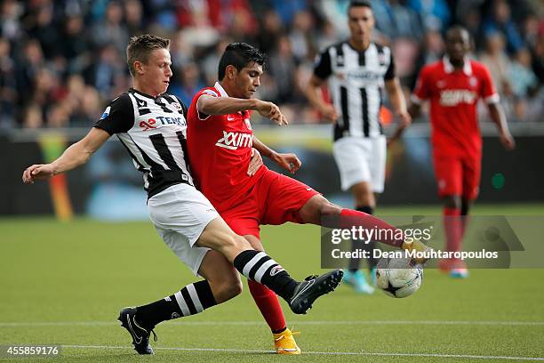 Mike te Wierik of Heracles tackles Jesus Corona of Twente during the Dutch Eredivisie match between Heracles Almelo and FC Twente at Polman Stadion...