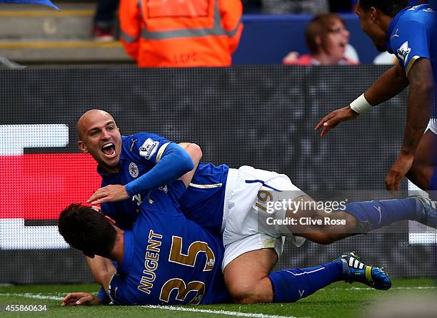 Esteban Cambiasso of Leicester City celebrates with David Nugent of Leicester City after scoring his team's third goal during the Barclays Premier...