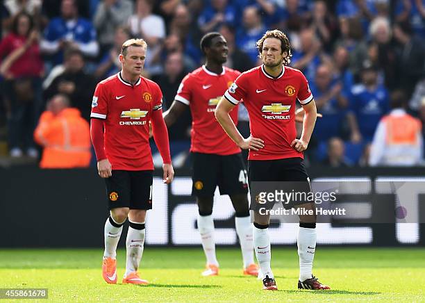 Dejected Manchester United players Wayne Rooney, Tyler Blackett and Daley Blind look on during the Barclays Premier League match between Leicester...