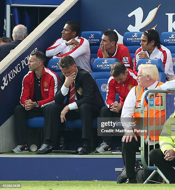Assistant Manager Ryan Giggs, Manager Louis van Gaal and Assistant coach Albert Stuivenberg of Manchester United show their disappointment during the...