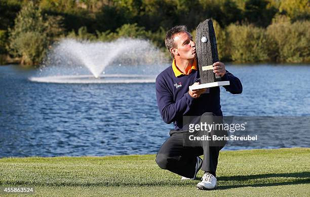 First place winner Paul Wesselingh of England kisses the trophy after winning the WINSTONgolf Senior Open played at WINSTONgolf on September 21, 2014...