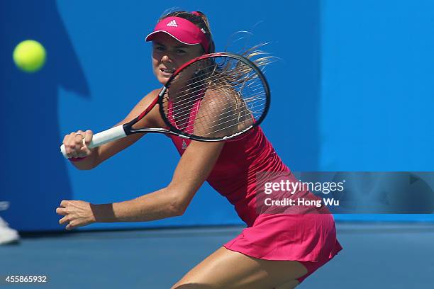 Daniela Hantuchova of Slovakia returns a shot during her match against Barbora Zahlavova Strycova of Czech Republic during day one of the 2014...