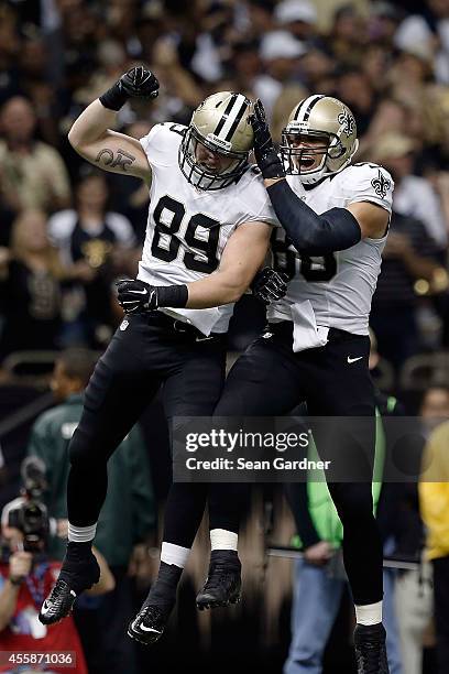Josh Hill and Jimmy Graham of the New Orleans Saints celebrate a touchdown during the first quarter of a game against the Minnesota Vikings at the...