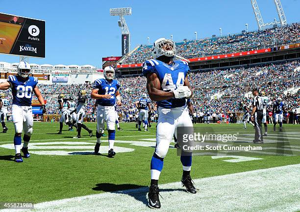 Ahmad Bradshaw of the Indianapolis Colts celebrates after scoring a first quarter touchdown against the Jacksonville Jaguars at EverBank Field on...