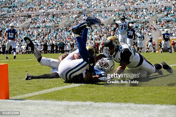 Dwayne Allen of the Indianapolis Colts scores a touchdown on a pass from Andrew Luck during the second quarter of the game against the Jacksonville...