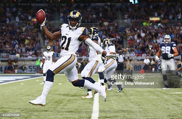 Janoris Jenkins of the St. Louis Rams returns an interception for a touchdown in the second against the Dallas Cowboys at the Edward Jones Dome on...