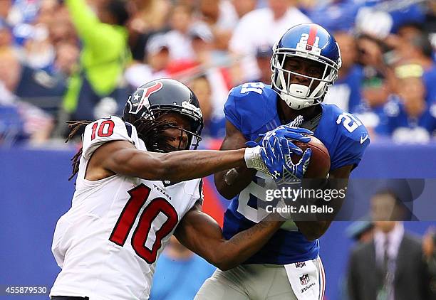 Dominique Rodgers-Cromartie of the New York Giants intercepts a pass intended for DeAndre Hopkins of the Houston Texans in the fourth quarter at...