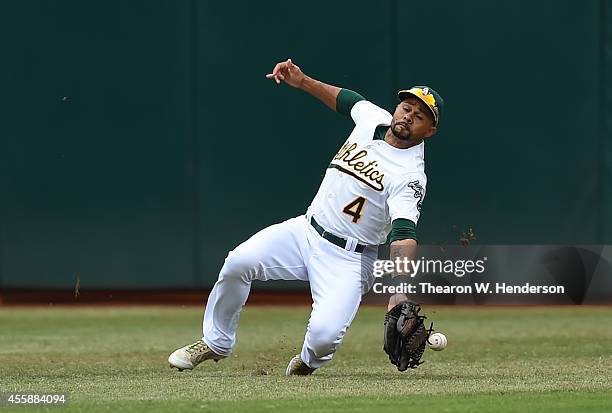 Coco Crisp of the Oakland Athletics can't make the catch that went for a double off the bat of Ryan Howard of the Philadelphia Phillies in the top of...