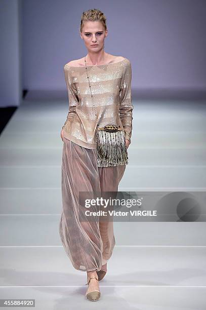 Model walks the runway during the Giorgio Armani Ready to Wear show as a part of Milan Fashion Week Womenswear Spring/Summer 2015 on September 20,...