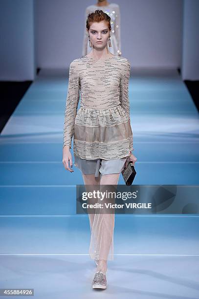 Model walks the runway during the Giorgio Armani Ready to Wear show as a part of Milan Fashion Week Womenswear Spring/Summer 2015 on September 20,...