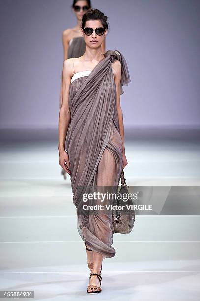 Model walks the runway during the Giorgio Armani Ready to Wear show as a part of Milan Fashion Week Womenswear Spring/Summer 2015 on September 20,...