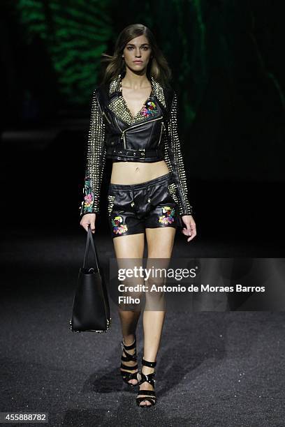 Model walks the runway during the Philipp Plein show as a part of Milan Fashion Week Menswear Spring/Summer 2015 on September 19, 2014 in Milan,...