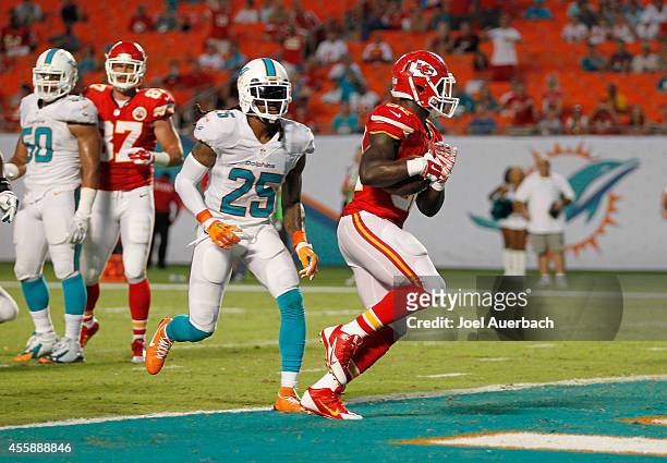 Running back Cyrus Gray of the Kansas City Chiefs scores a fourth-quarter touchdown against the Miami Dolphins in their game at Sun Life Stadium on...