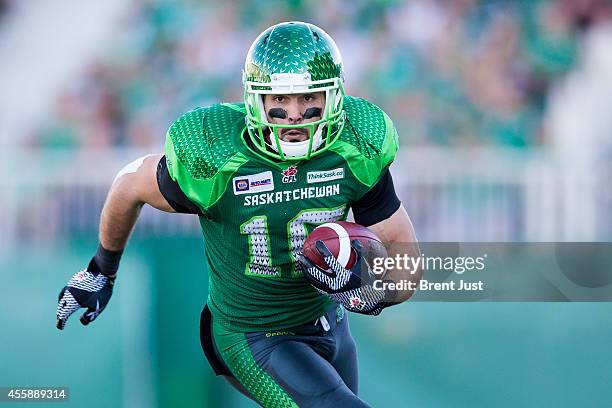 Brett Swain of the Saskatchewan Roughriders runs with the ball in a game between the Ottawa Redblacks and Saskatchewan Roughriders in week 13 of the...