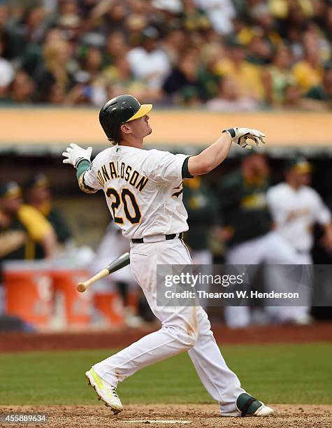 Josh Donaldson of the Oakland Athletics hits a walk-off, two-run homer against the Philadelphia Phillies in the bottom of the tenth inning at O.co...