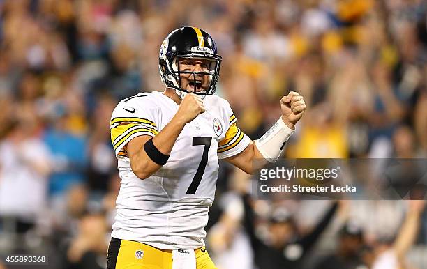 Ben Roethlisberger of the Pittsburgh Steelers reacts after a touchdown in the first half during the game against the Carolina Panthers at Bank of...