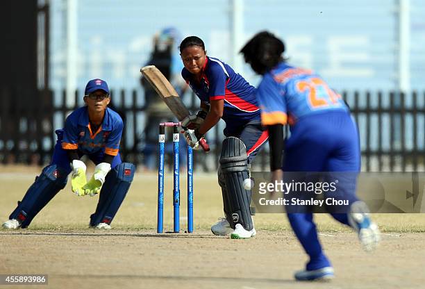 Magar Sita Rana of Nepal defends during the Cricket Women's Group D match between Nepal and Malaysia during day three of the 2014 Asian Games at...