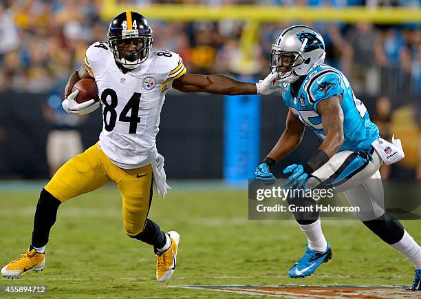 Antonio Brown of the Pittsburgh Steelers runs against Bene Benwikere of the Carolina Panthers in the 1st half during their game at Bank of America...