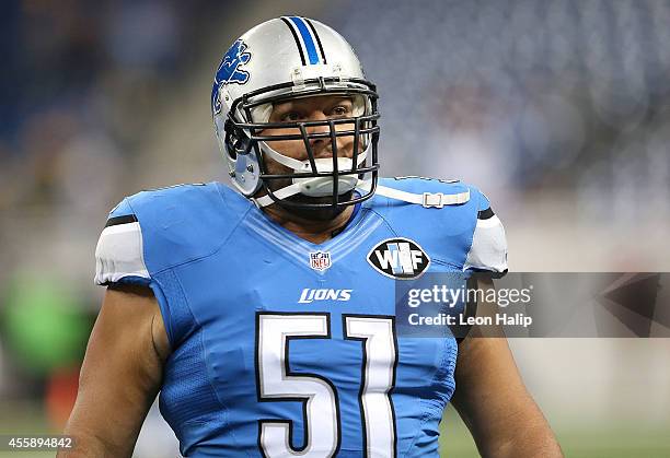 Dominic Raiola of the Detroit Lions runs onto the field during player introductions prior to the start of the game against the Green Bay Packers at...