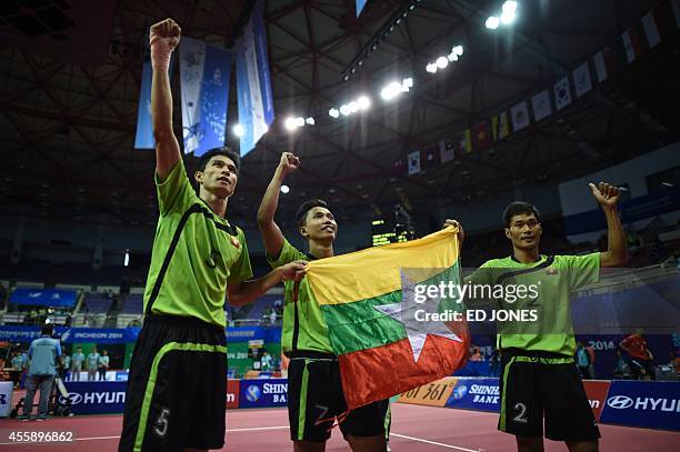 Latt Zaw , Lin Aung Wai , and Zaw Aung Zaw of Myanmar celebrate following their win against South Korea during their Sepaktakraw men's double final...