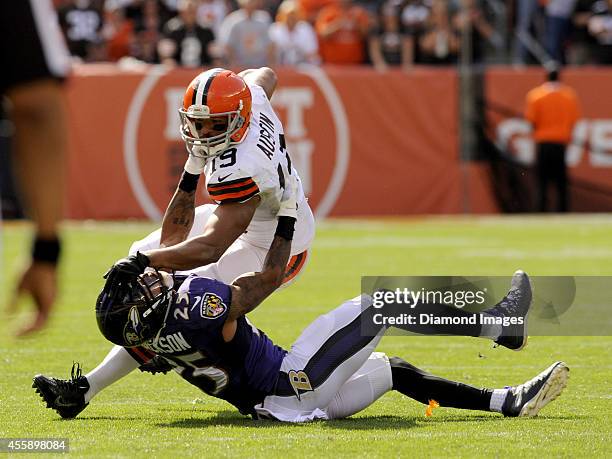 Wide receiver Miles Austin of the Cleveland Browns is tackled by cornerback Asa Jackson of the Baltimore Ravens during a game on September 21, 2014...