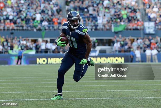 Wide receiver Percy Harvin of the Seattle Seahawks carries the ball against the Denver Broncos at CenturyLink Field on September 21, 2014 in Seattle,...