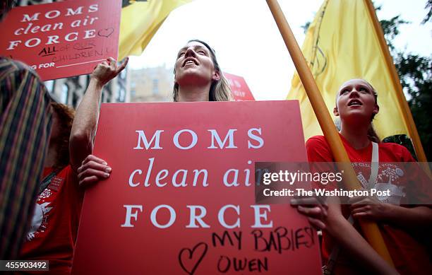 Kelly Nichols, from the Moms Clean Air Force, marches in the People's Climate March in Manhattan, NY, on September 21, 2014.