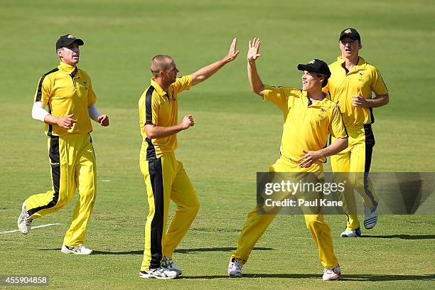 Nathan Rimmington and Luke Towers of the WA XI celebrate the wicket of Mohammad Javid of Afghanistan during the One Day friendly match between the...