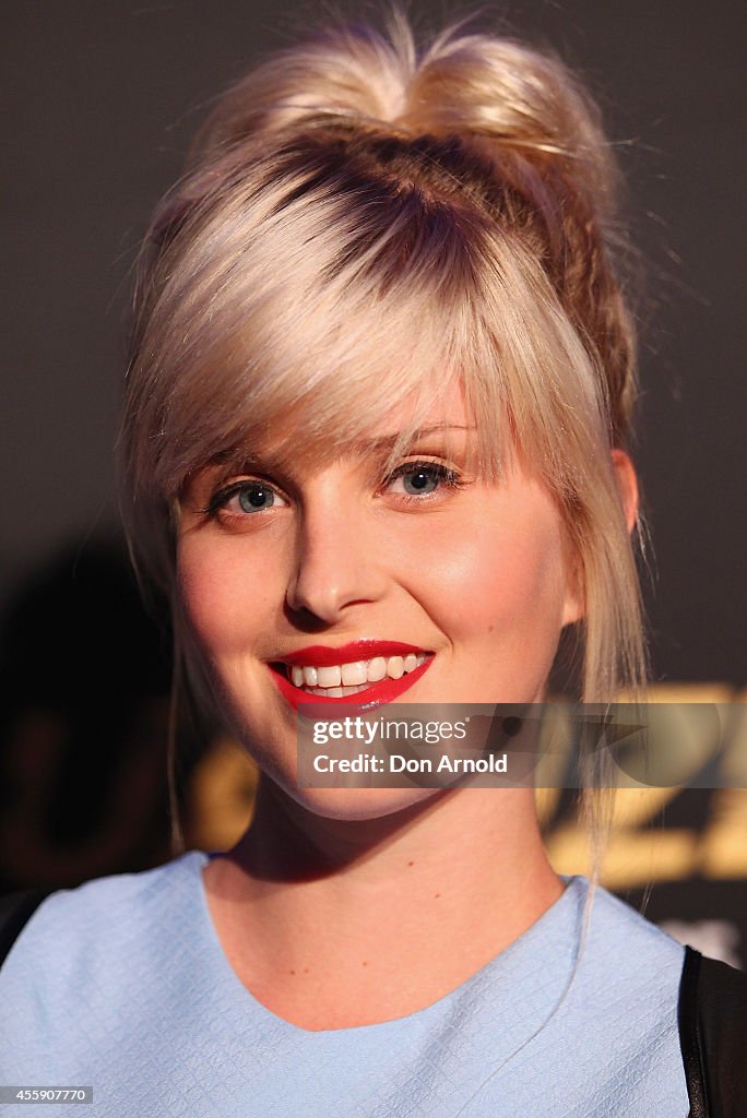 Ami Ruff Amy Ruffle poses on the red carpet at