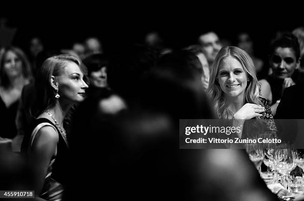 An alternative view of Poppy Delevingne at amfAR's Milano 2014 duirng the Milan Fashion Week Womenswear Spring/Summer 2015 on September 20, 2014 in...