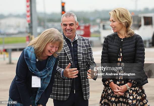 Paul McGinley, Captain of the Europe team and wife Allison McGinley talk to Shona Robison, Scotland's Minister for Sport as they wait for the arrival...