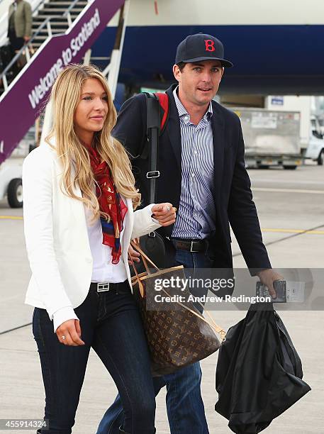 Keegan Bradley of the United States and partner Jillian Stacey arrive at Edinburgh Airport ahead of the 2014 Ryder Cup at Gleneagles on September 22,...