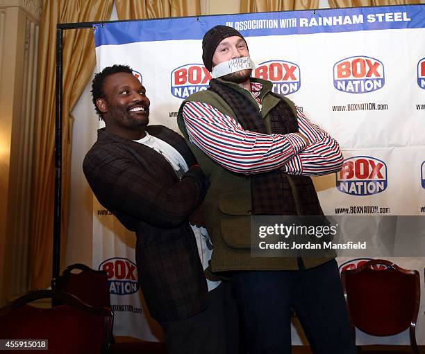 Dereck Chisora and Tyson Fury go head-to-head during the Dereck Chisora And Tyson Fury Press Conference at The Grosvenor House on September 22, 2014...