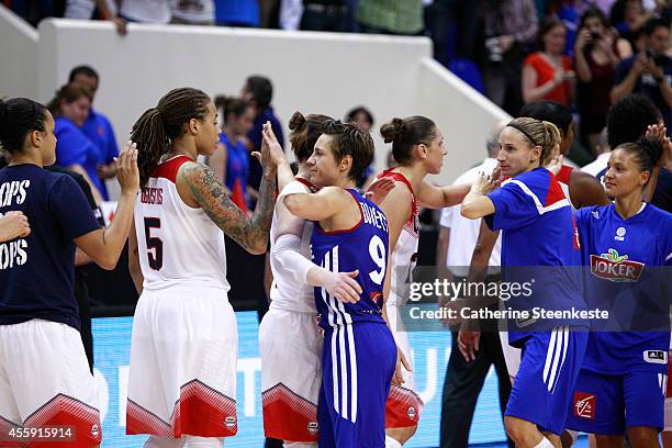 Seimone Augustus of the USA Basketball Women's National Team congratulates Celine Dumerc of the French Basketball Women's National Team after the...