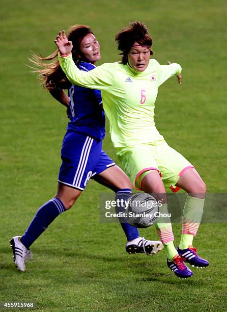 Kana Osafune of Japan competes for the ball with Wang Hsiang Huei of Chinese Taipei during the Football Womens Group B match between Chinese Taipei...