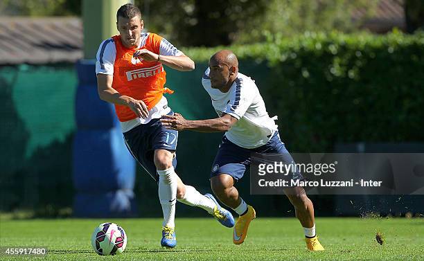 Cicero Moreira Jonathan competes for the ball with Zdravko Kuzmanovic during FC Internazionale training session at the club's training ground on...
