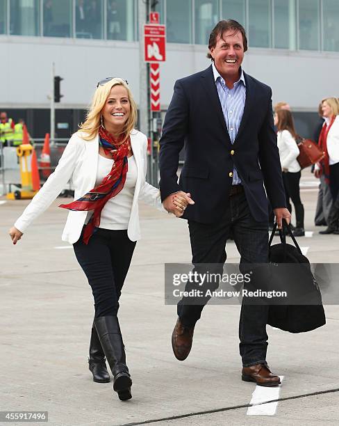 Phil Mickelson of the United States and wife Amy Mickelson arrive at Edinburgh Airport ahead of the 2014 Ryder Cup at Gleneagles on September 22,...