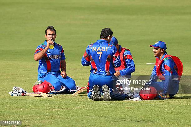 Samiullah Shinwari and Mohammad Nabi of Afghanistan sit for a drinks break during the One Day tour match between the Western Australia XI and...
