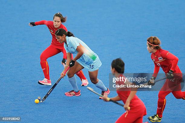 Poonam Rani of India in action against Salocha Losakul of Thailand during the Hockey Women's Pool A match between India and Thailand during day three...