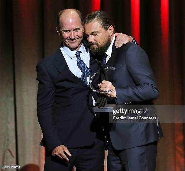 President and CEO of World Wildlife Fund, Carter Roberts presents actor/activist Leonardo DiCaprio the Clinton Global Citizen Leadership in...