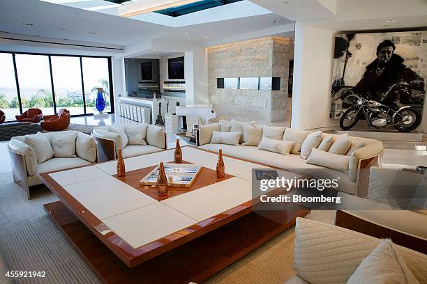 The main room with a custom table and Bentley Motors Ltd. Chairs is seen inside a mansion at 1181 N. Hillcrest Road at Trousdale Estates in Beverly...