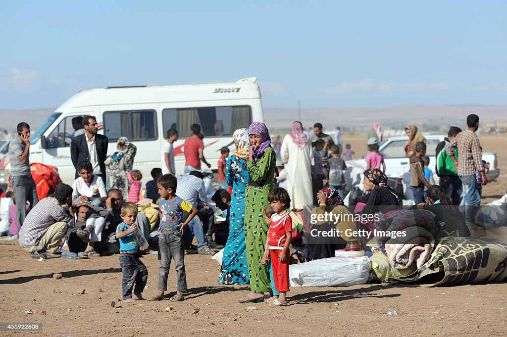 Syrian Kurds Fleeing The Islamic State Militants Cross Into Turkey