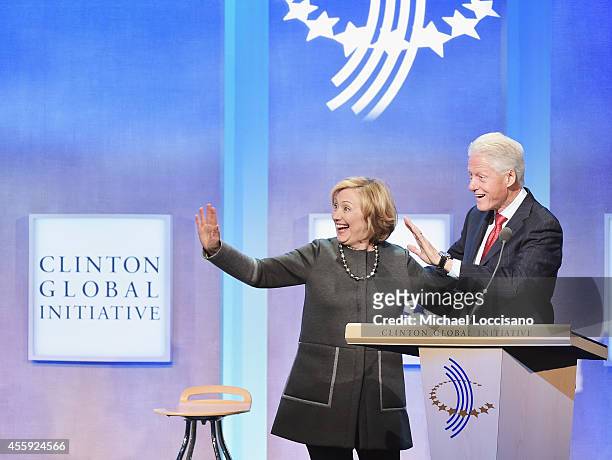 Former US Secretary of State Hillary Clinton and husband, Former U.S. President Bill Clinton address the audience during the Opening Plenary Session:...