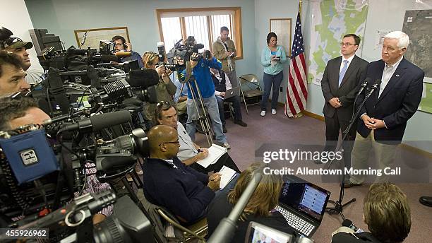 Pennsylvania Governor Tom Corbett briefs the media along with Pike County District Attorney Ray Tonkin, left, on the status of the manhunt for...