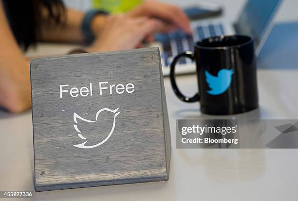 The Twitter Inc. Logo is displayed as an employee works the company's headquarters in San Francisco, California, U.S., on Friday, Sept. 19, 2014....