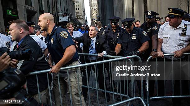 Protesters demanding economic and political changes to curb the effects of global warming clash with police as try to walk down Wall Street towards...