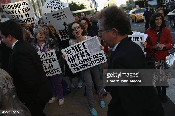 Protesters, many of them Jewish activists, demonstrate as people arrive for the opening night of the Metropolitan Opera season at Lincoln Center on...